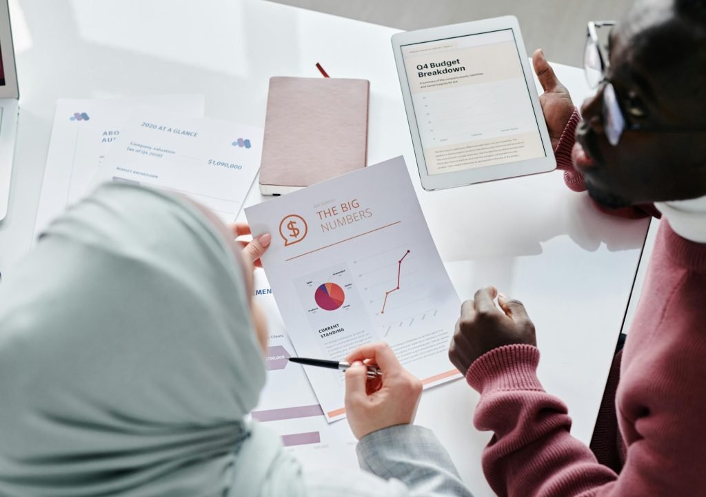 Research and Data Analysis Analysts reviewing data charts and reports during a research and evaluation session